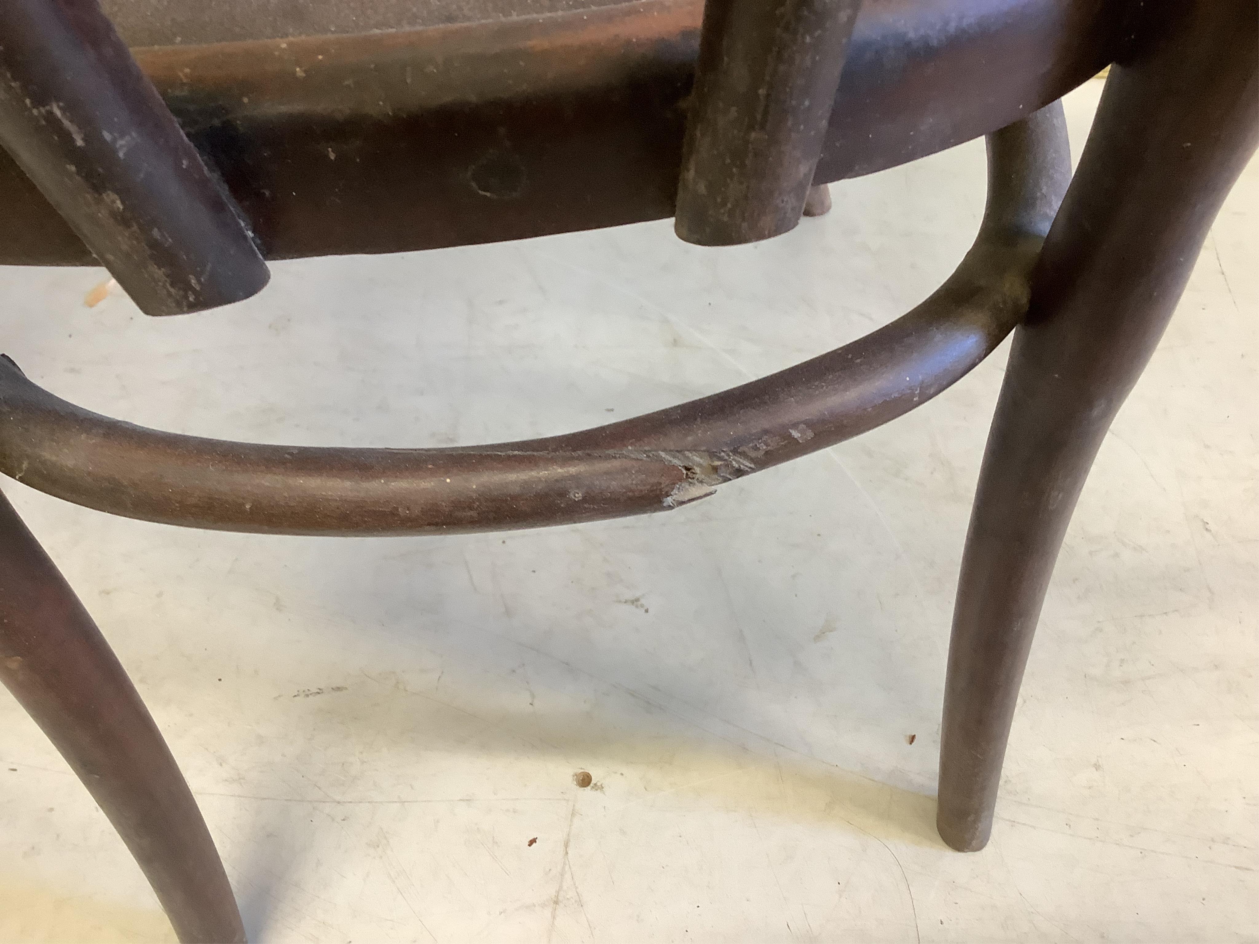 A pair of Thonet style bentwood elbow chairs, width 58cm, depth 56cm, height 92cm